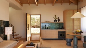 A modern kitchen with a stone backsplash, wooden cabinets, and a round dining table.