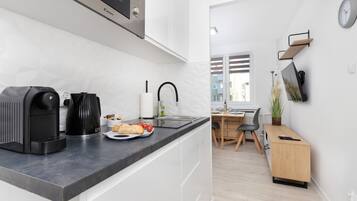 Fridge, microwave, stovetop, coffee/tea maker
