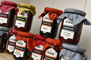 A display of various jars of Beieren brand confituer, including flavors like plum, almond, and lavender. - B&B 't Motjeshof (Pittem)