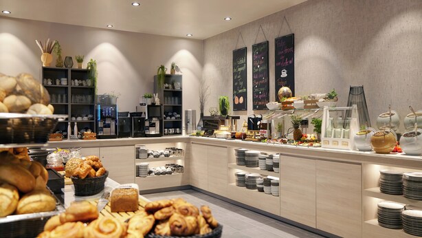 A buffet area with various food items, including pastries and fruits, and a coffee station. - Candlewood Suites Dusseldorf Airport by IHG (Düsseldorf)