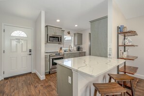 Fully Equipped Stainless Steel Kitchen w/ Bar Seating