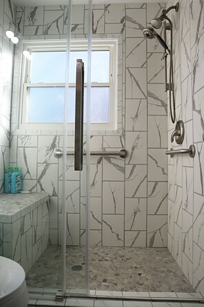 Shower, hair dryer, towels, soap