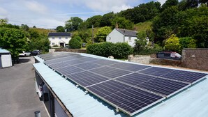 A solar panel array on a building roof.