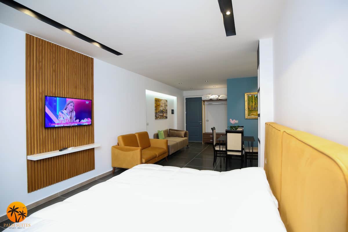 Deluxe Suite, Beach View | 1 bedroom, iron/ironing board (on request), free WiFi, bed sheets