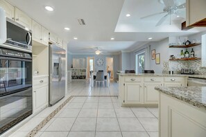 Enjoy meals in the kitchen with a central island, oven, and dining area.
