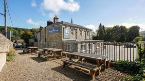 The Greenhead Hotel with outdoor seating and a parking area. - The Greenhead Hotel (Brampton)