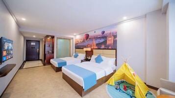 A hotel room with two beds, a television, a wall mural, and a tent.