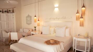 Habitación suite | Ropa de cama de alta calidad y edredones de plumas