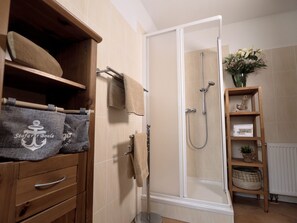 Shower, hair dryer, towels, soap