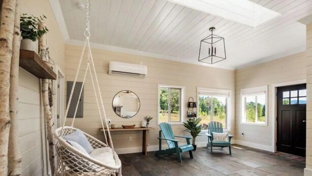 A spacious porch with a hanging chair, two Adirondack chairs, a wooden bench, and a large mirror. - Charming 2BR Farmhouse Amazing View of Mt. Rainier - Family Friendly + Game Barn (Mineral)
