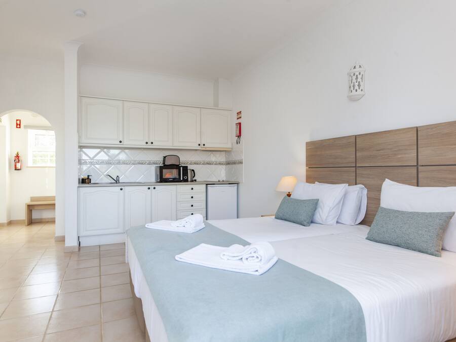 Apartment, 1 Bedroom, Pool View | Laptop workspace, blackout drapes, WiFi (free), bed sheets