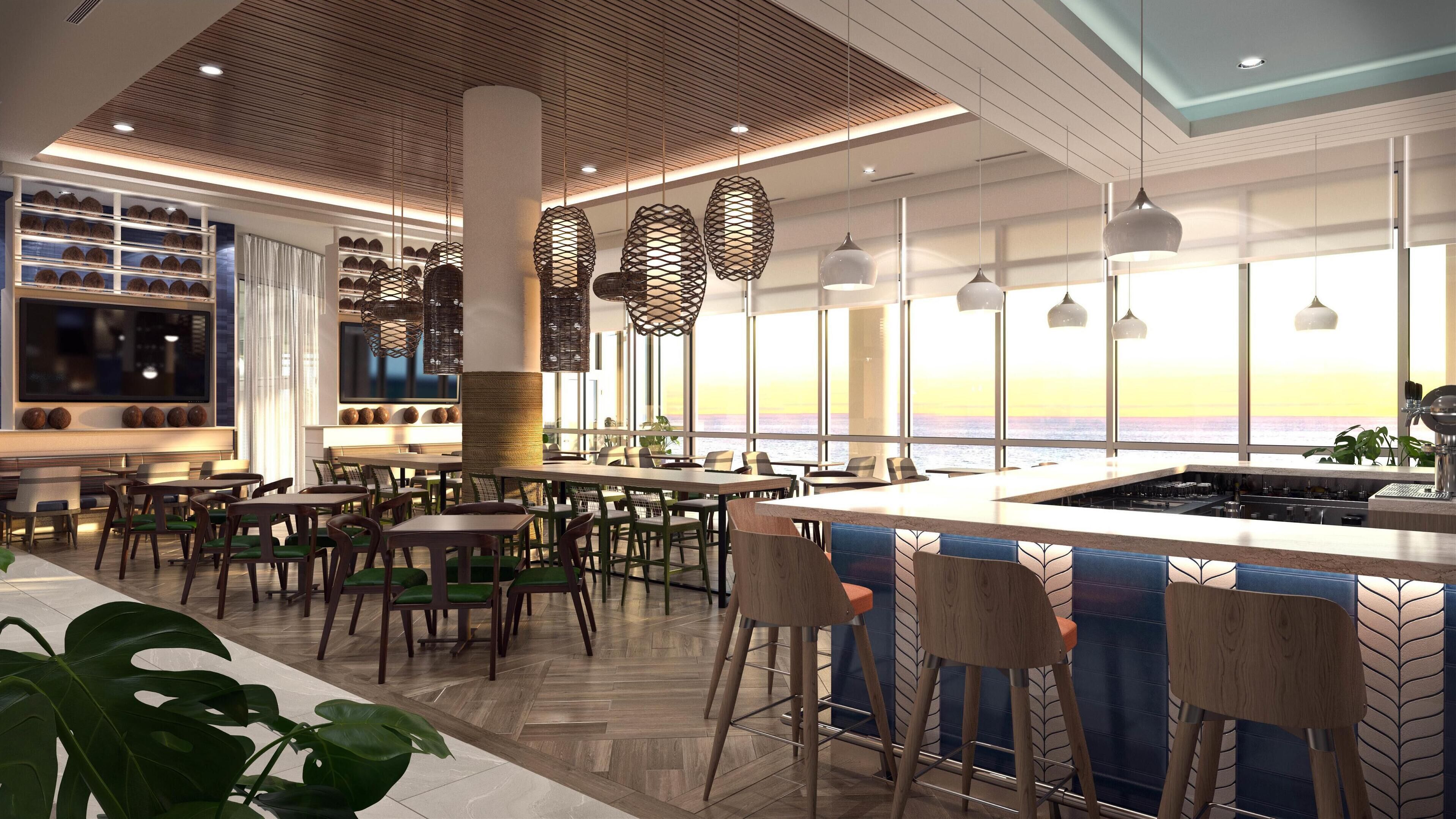 Un restaurant moderne doté d’un bar, de grandes fenêtres offrant une vue panoramique et d’un éclairage contemporain.