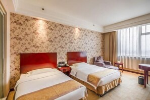 A hotel room with two beds, a red headboard, a small desk, a chair, and a view of the outdoors through large windows. - Mei Di Ya Zhong Hua Hotel (Zhuolu)