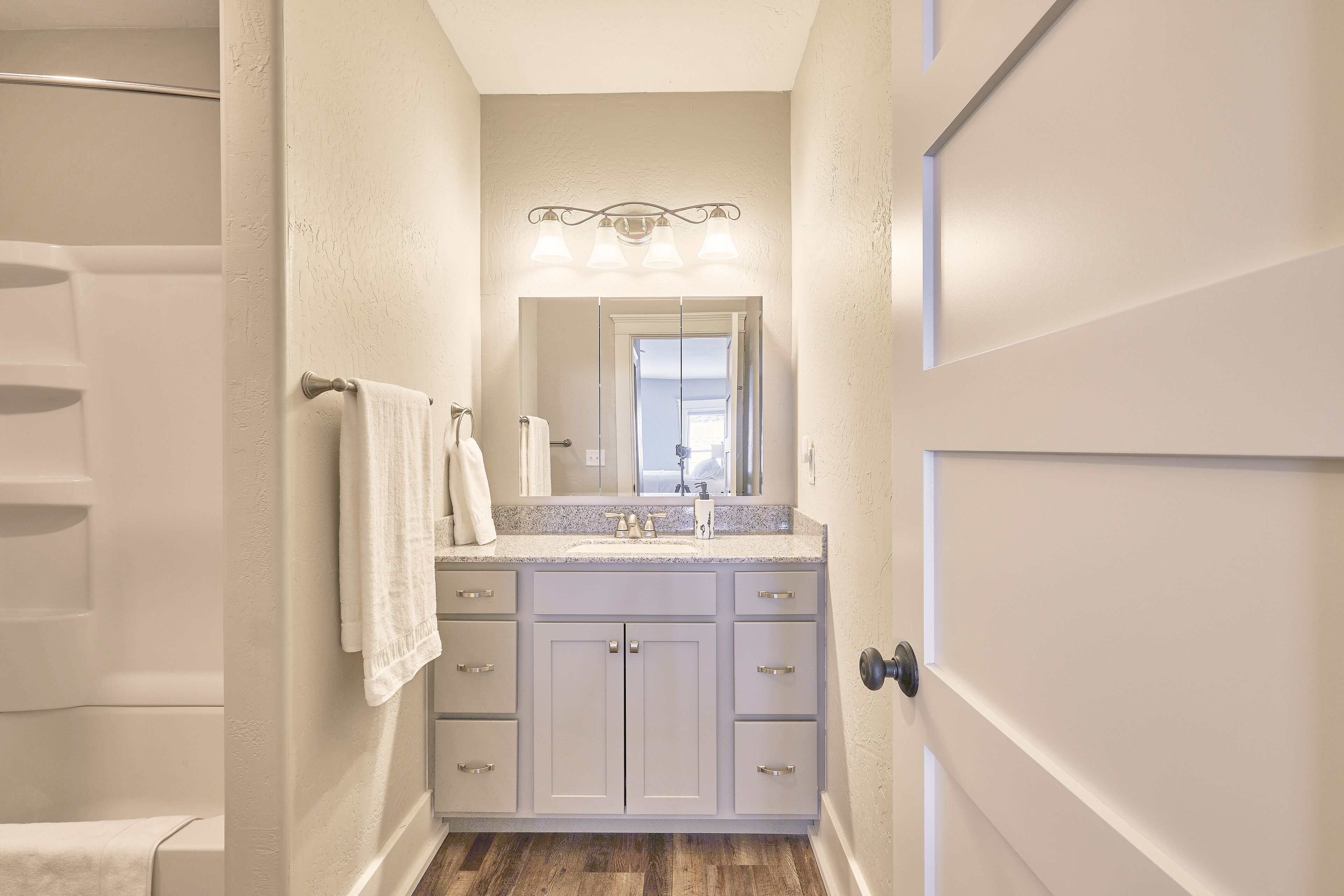 Combined shower/tub, hair dryer, towels, soap
