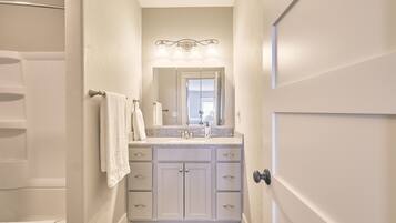 Combined shower/tub, hair dryer, towels, soap