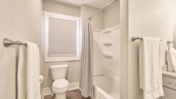 Combined shower/tub, hair dryer, towels, soap