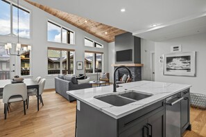 TM411 Two Bedroom Elevated Condo | Living area | 50-inch Smart TV with cable channels, TV, fireplace - Spring Creek Vacations (Canmore)