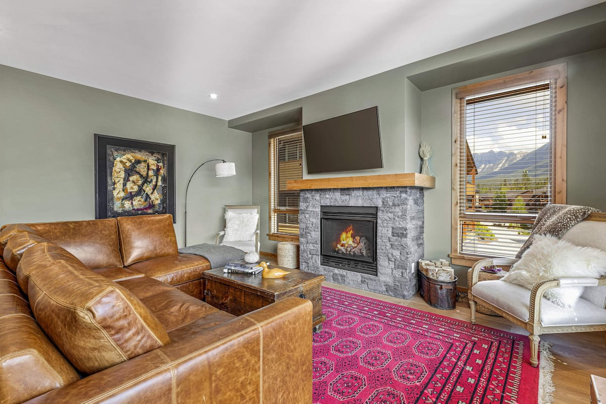 T203B One Bedroom Condo | Living room | 50-inch Smart TV with cable channels, TV, fireplace