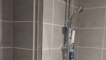 Apartment, 1 Queen Bed | Bathroom | Shower, towels