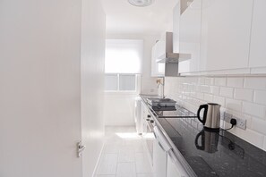 Apartment | Private kitchen | Fridge, microwave, oven, stovetop