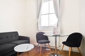 Apartment | Living room | 30-inch TV with digital channels