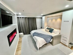 1 habitación, tabla de planchar con plancha, wifi gratis y ropa de cama 