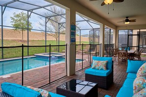 Outdoor pool, a heated pool - Epic 9BR Game House - Arcade, PS5, Pool & Hot Tub (Davenport)