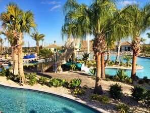 Outdoor pool, a heated pool - Epic 9BR Game House - Arcade, PS5, Pool & Hot Tub (Davenport)