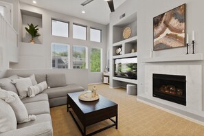 Smart TV, fireplace, books, offices