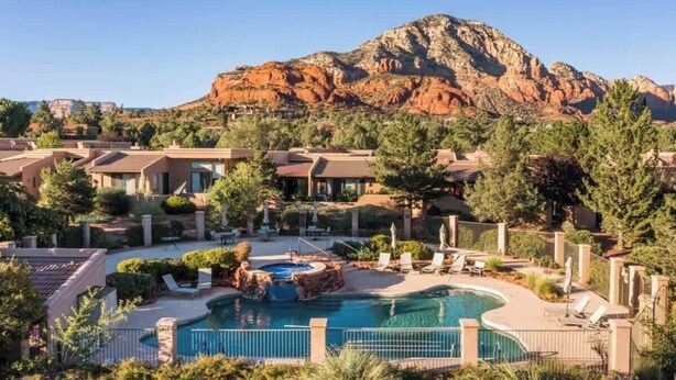 A resort with multiple buildings, a swimming pool, and a mountain in the background. - Lux 2-King Suite Luxury Townhome! Pool + Hot Tub! (Sedona)