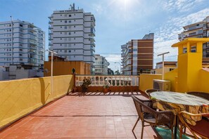Enjoy dining or relaxing on the rooftop terrace with a view of the surrounding cityscape.