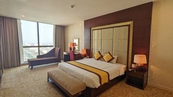 Suite ejecutiva | 1 dormitorio, sistema de insonorización, tabla de planchar con plancha