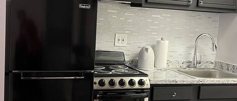 Microwave, coffee/tea maker, cookware/dishes/utensils, paper towels