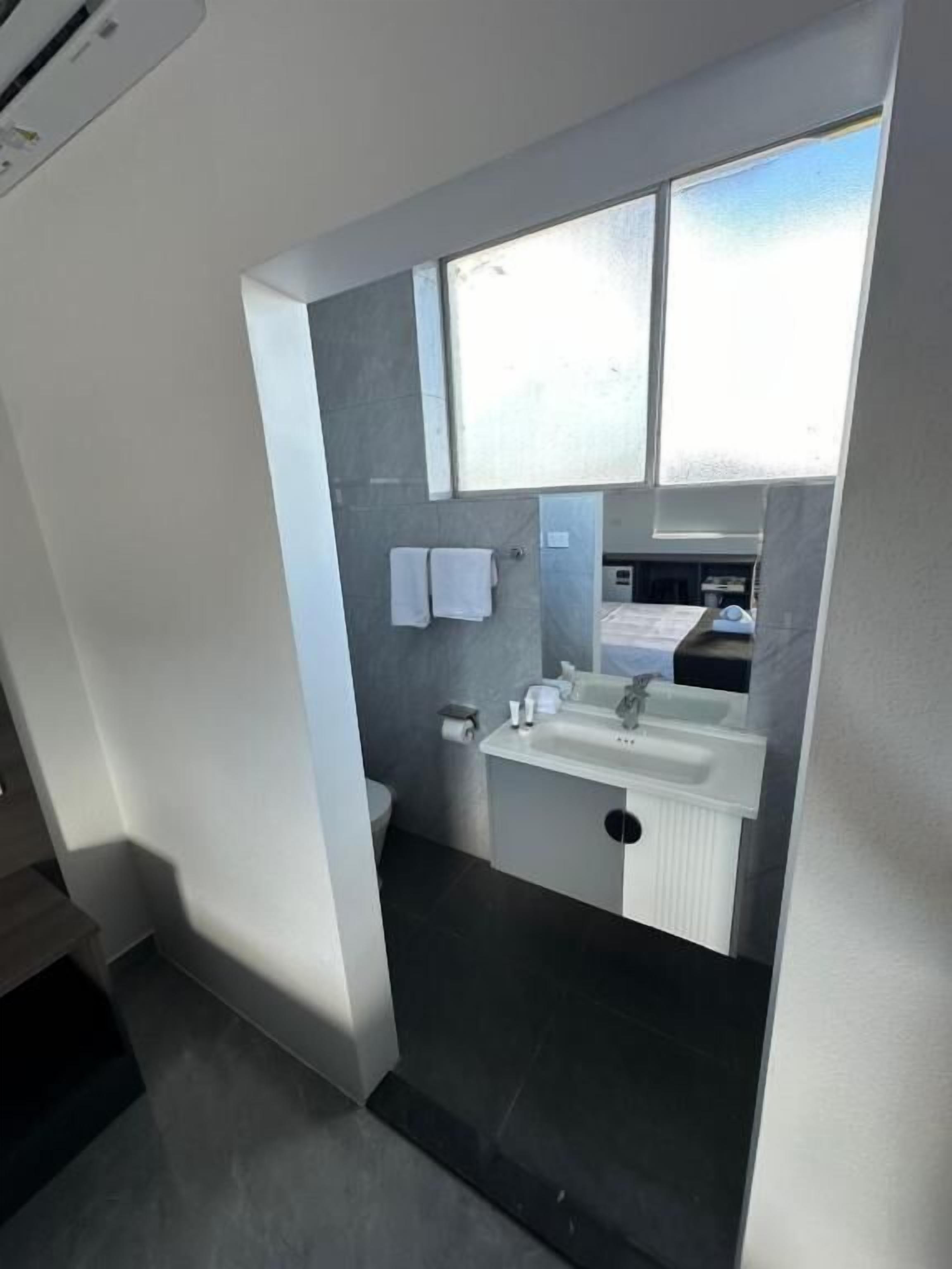 budget queen | 1 bedroom, individually furnished, desk, laptop workspace