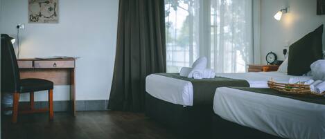 Individually furnished, desk, laptop workspace, blackout drapes