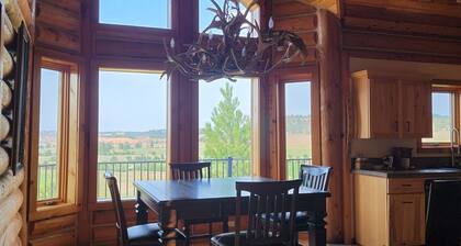 Large garage for bikes. Beautiful log home. On golf course.