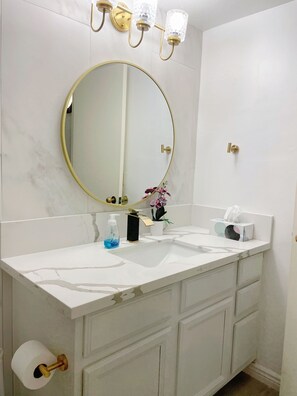 Combined shower/tub, hair dryer, towels, soap