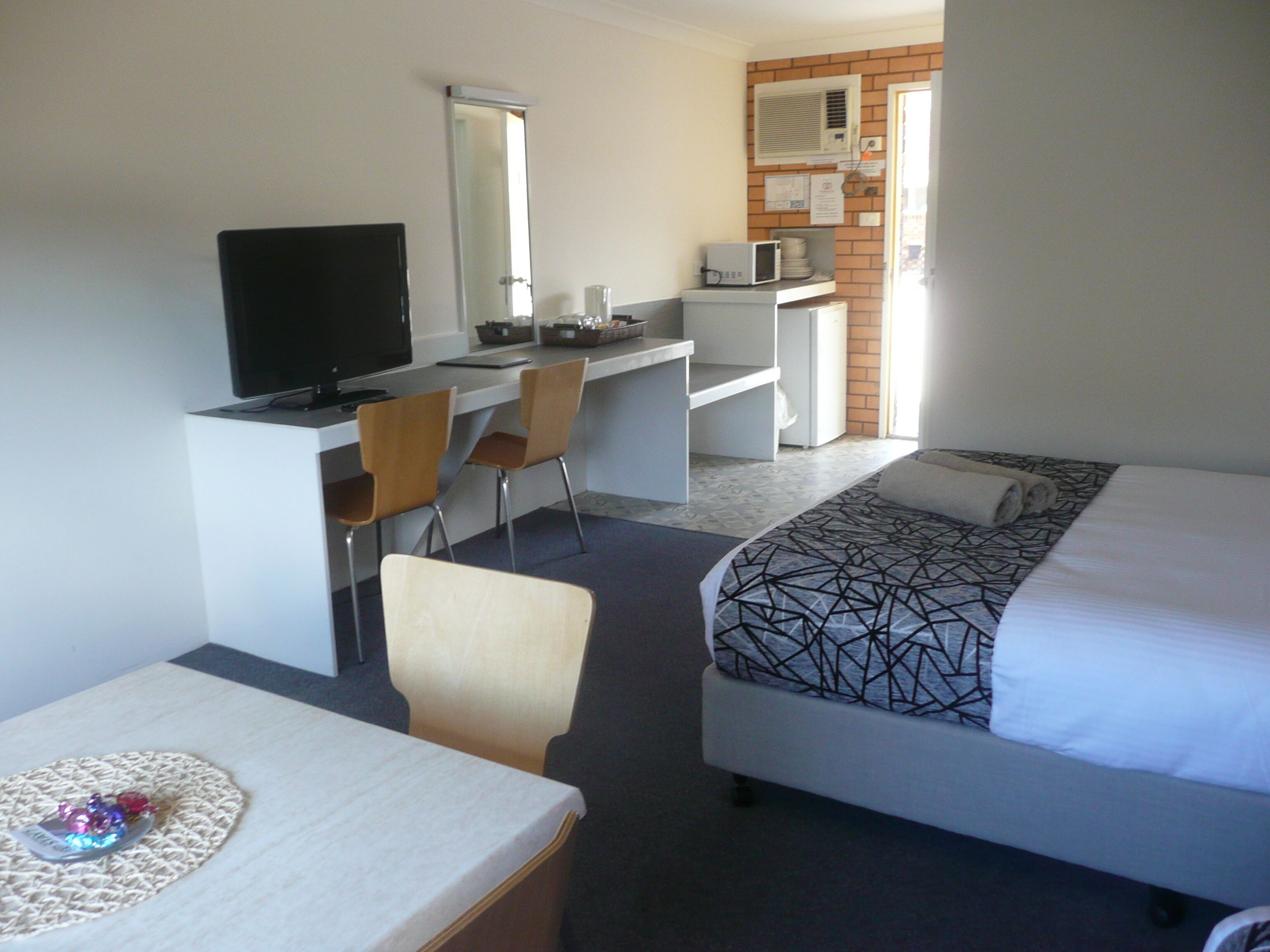 1 bedroom, desk, iron/ironing board, travel crib