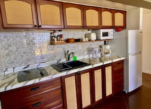 Fridge, microwave, stovetop, coffee/tea maker
