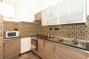 Fridge, stovetop, toaster, cookware/dishes/utensils