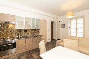 Fridge, stovetop, toaster, cookware/dishes/utensils