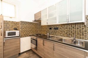 Fridge, stovetop, toaster, cookware/dishes/utensils