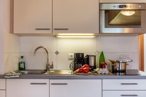 Fridge, microwave, stovetop, coffee/tea maker