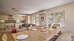 A modern kitchen with a dining area. - 'The Glabin’: Garrison Gem w/ Hot Tub & Fire Pit (Garrison)