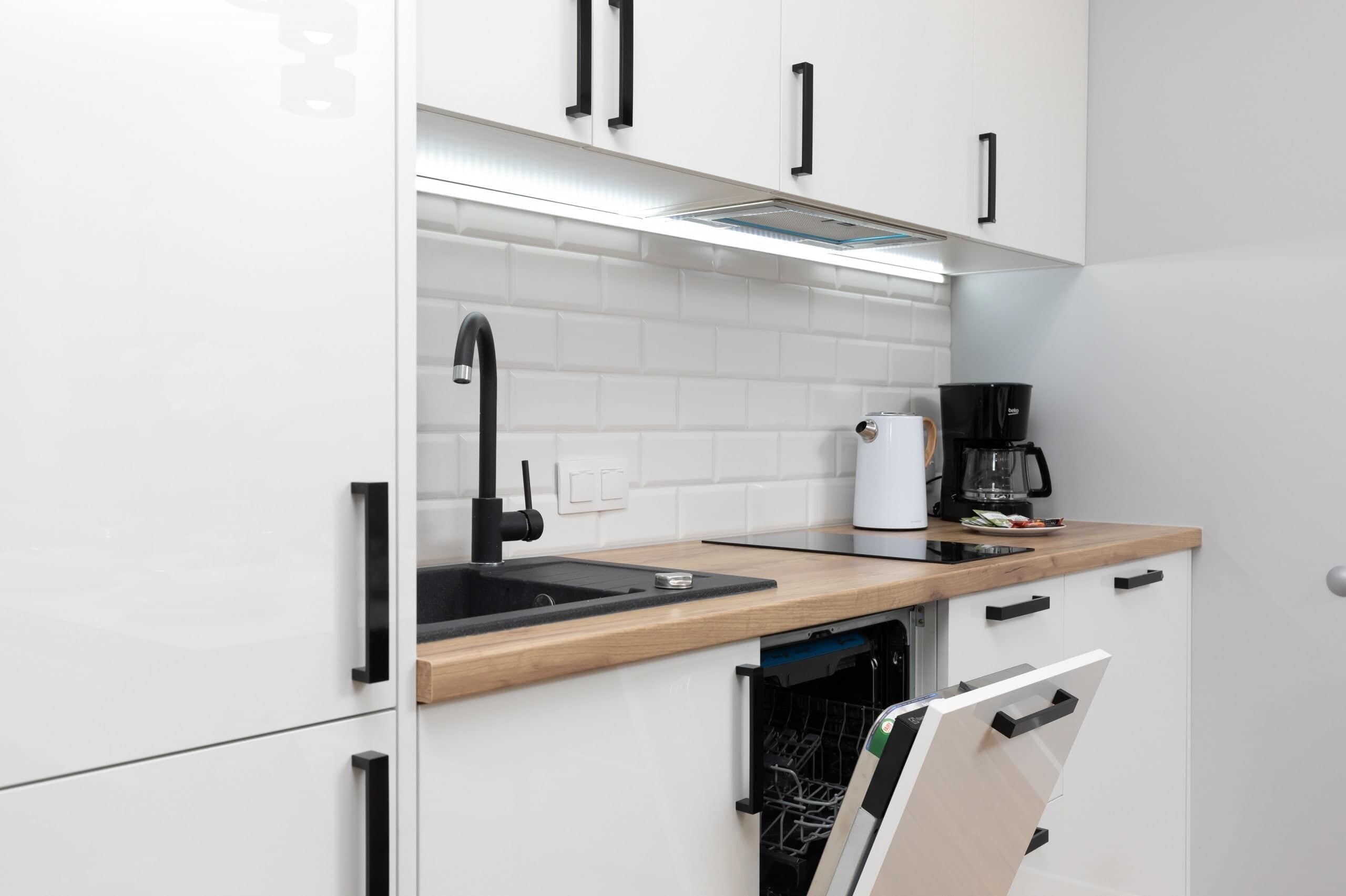 Fridge, stovetop, dishwasher, coffee/tea maker