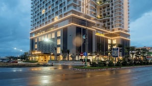 A high-rise hotel with multiple balconies and a prominent signage for Mandala Hotel & Spa in Phu Yen. - Mandala Hotel & Spa Phu Yen - 24-hour stay (Tuy Hoa)