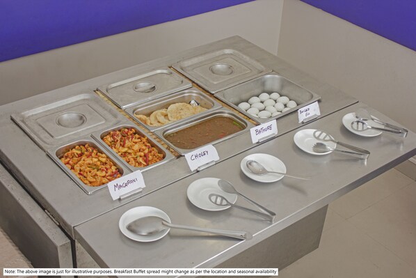 A buffet with labeled food sections including Macaroni, Chowley, and Boiled Eggs.