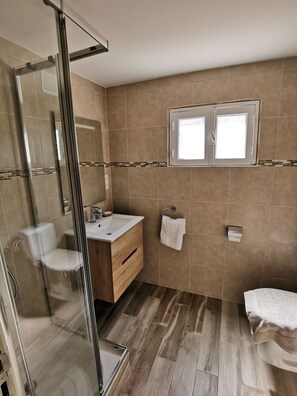 Shower, hair dryer, towels, soap