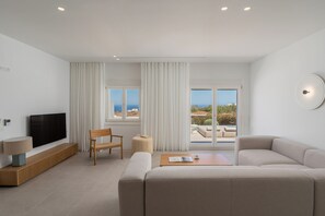 Exclusive Villa, Private Pool, Sea View | Living area | 50-inch Smart TV with satellite channels, TV - Lilium Homes (Santorini)