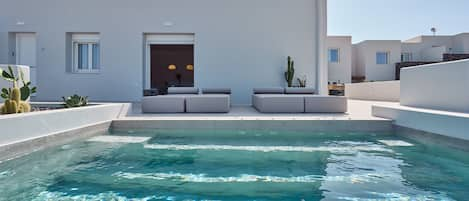 Seasonal outdoor pool, pool loungers